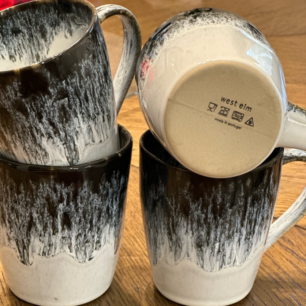 Set of 4. West Elm reactive pottery mugs black and white